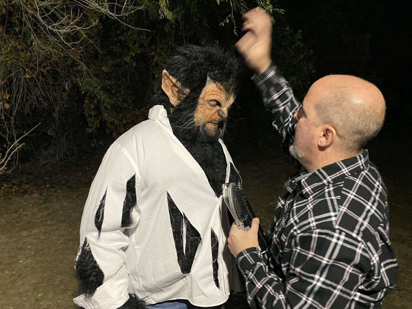 Shawn Gordon brushing out the werewolf costume's fur
