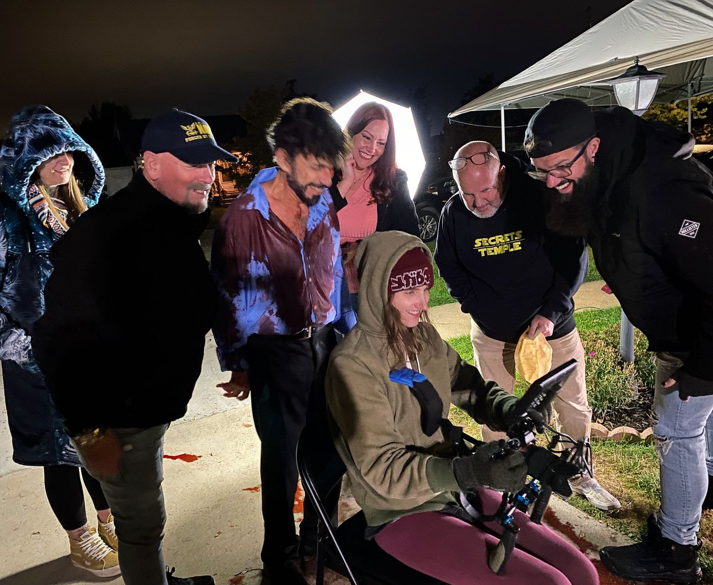 Cast and crew reviewing a take on set: Michael Rathburn, Dennis Record, Heather Hyer Haynes, Shawn Gordon, Jesse Howell, and DP Madison Easley on camera
