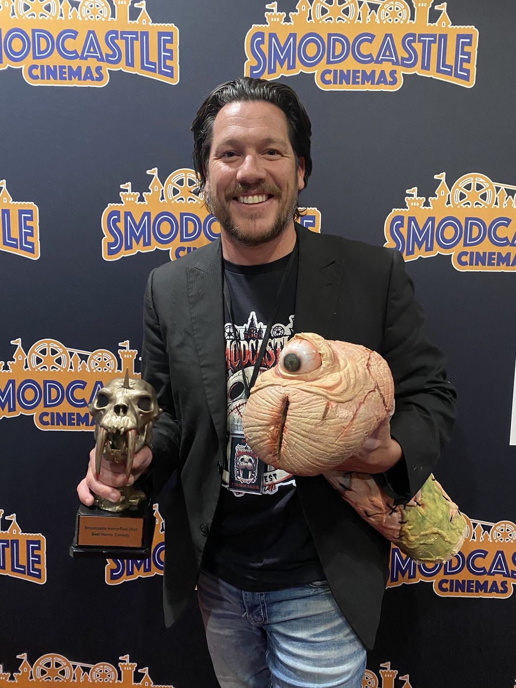 Ryan McDonald with the film's creature and the award at the SModCastle Film Festival
