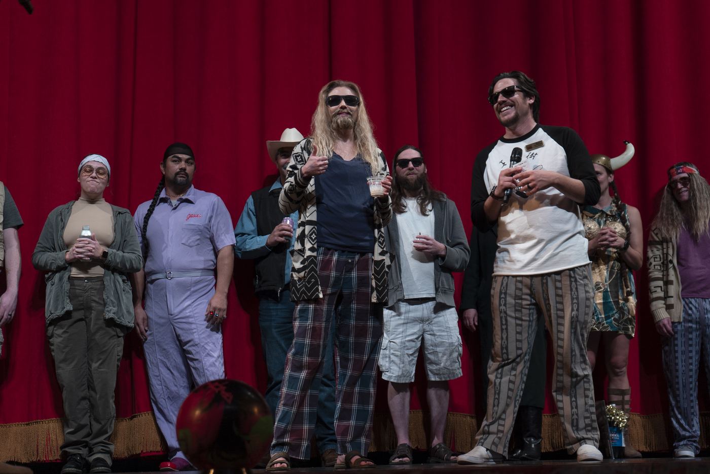 Full costume lineup including a nihilist and Maude on stage