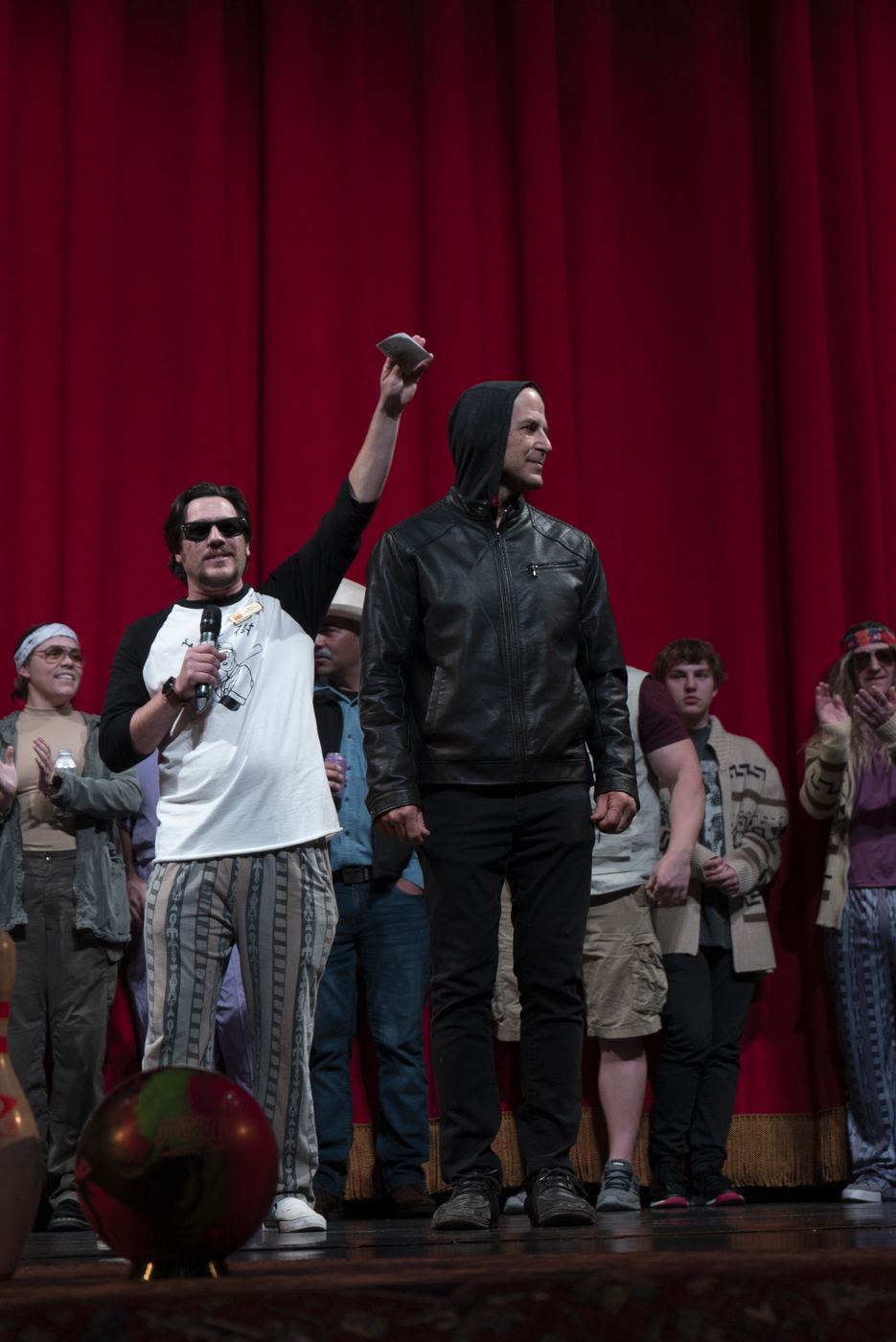 Costume contestants on stage including a Jesus Quintana costume