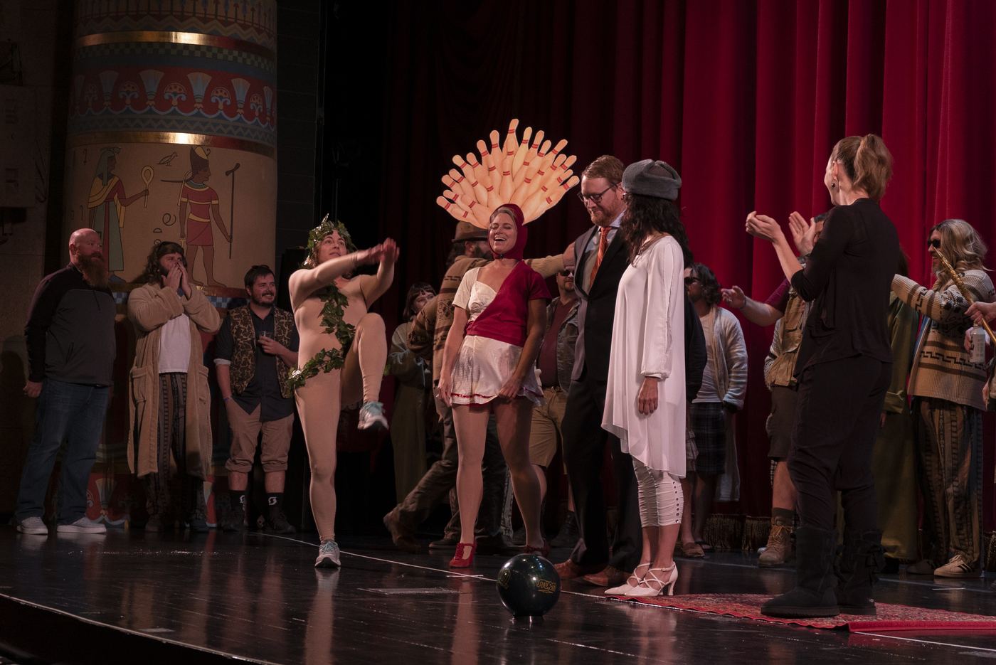 Costume contest contestants including a bowling pin headdress