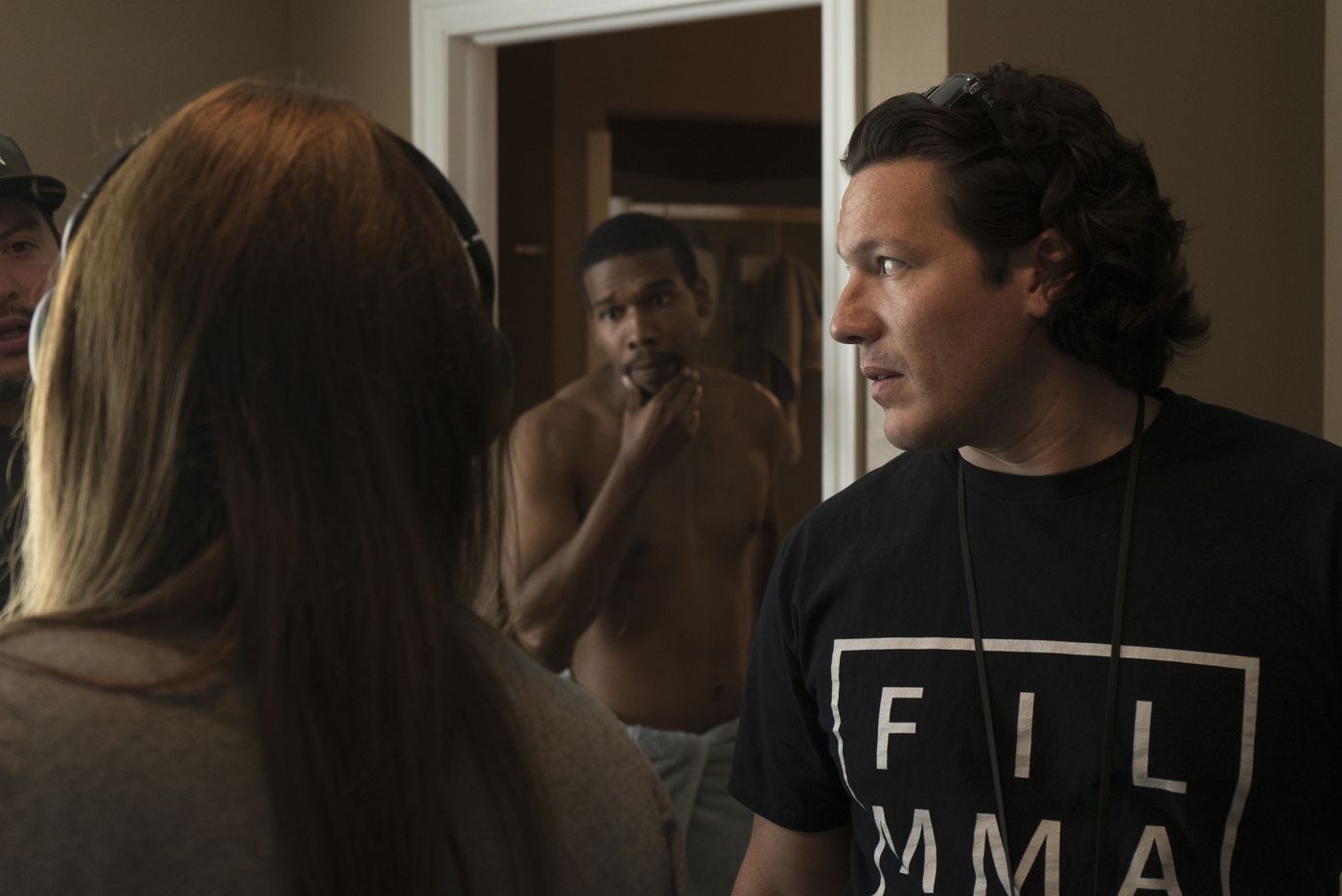 Director Ryan McDonald talking with an actor between takes