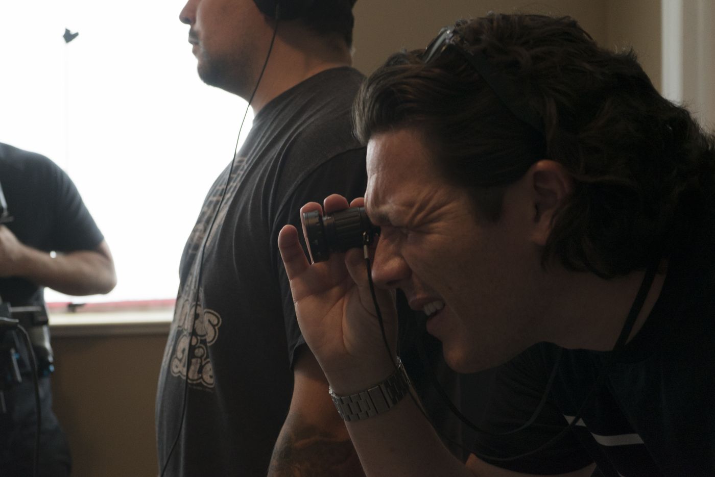 Writer/director Ryan McDonald finding the shot through a viewfinder